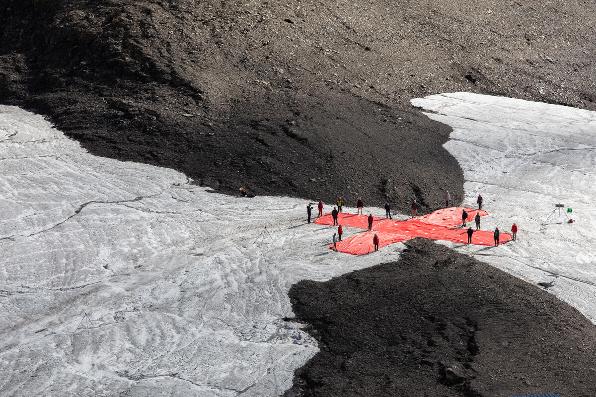 Climate Seniors' Band-aid to Protest Climate Inaction at Swiss Glacier. © Miriam Künzli / Ex-Press / Greenpeace